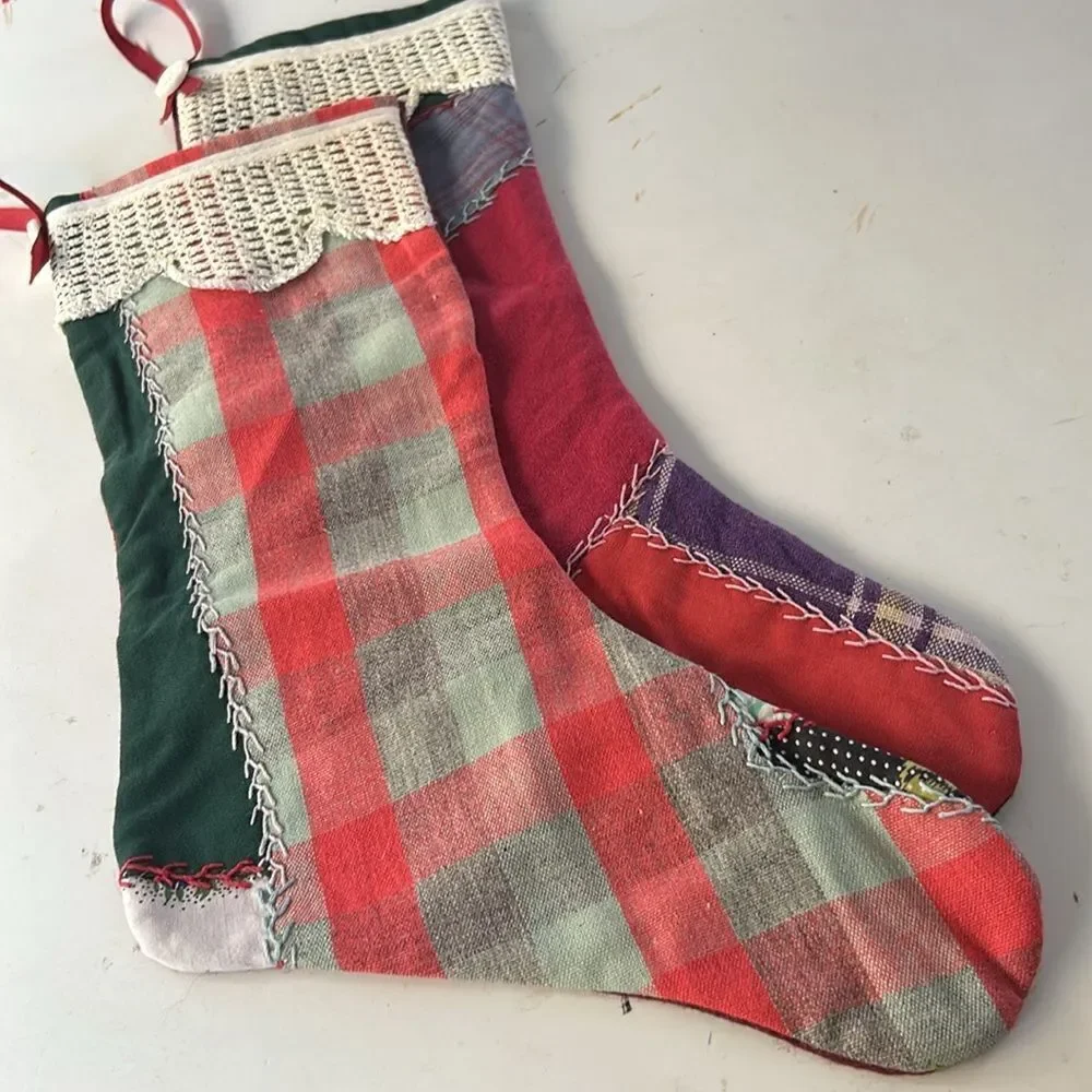 Two vintage handmade embroidered patchwork Christmas stockings